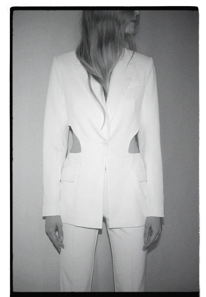 Ivory suit with cuts on the jacket
